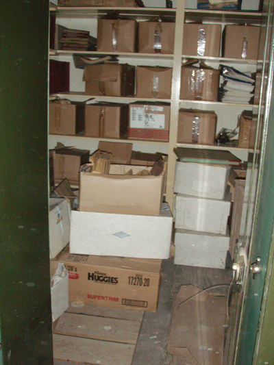Photo of boxes on shelves.